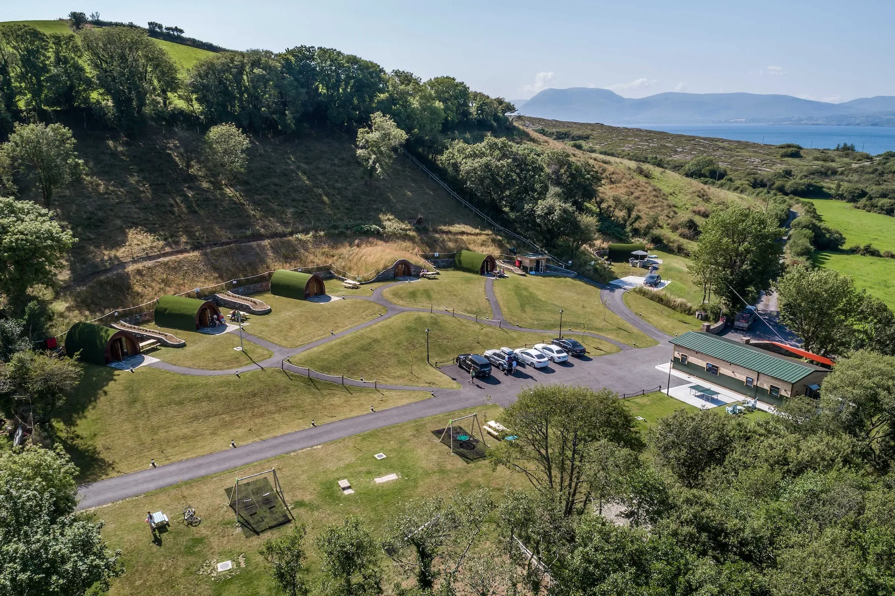 Green-roofed pods set into the West Cork landscape at Goats Path
